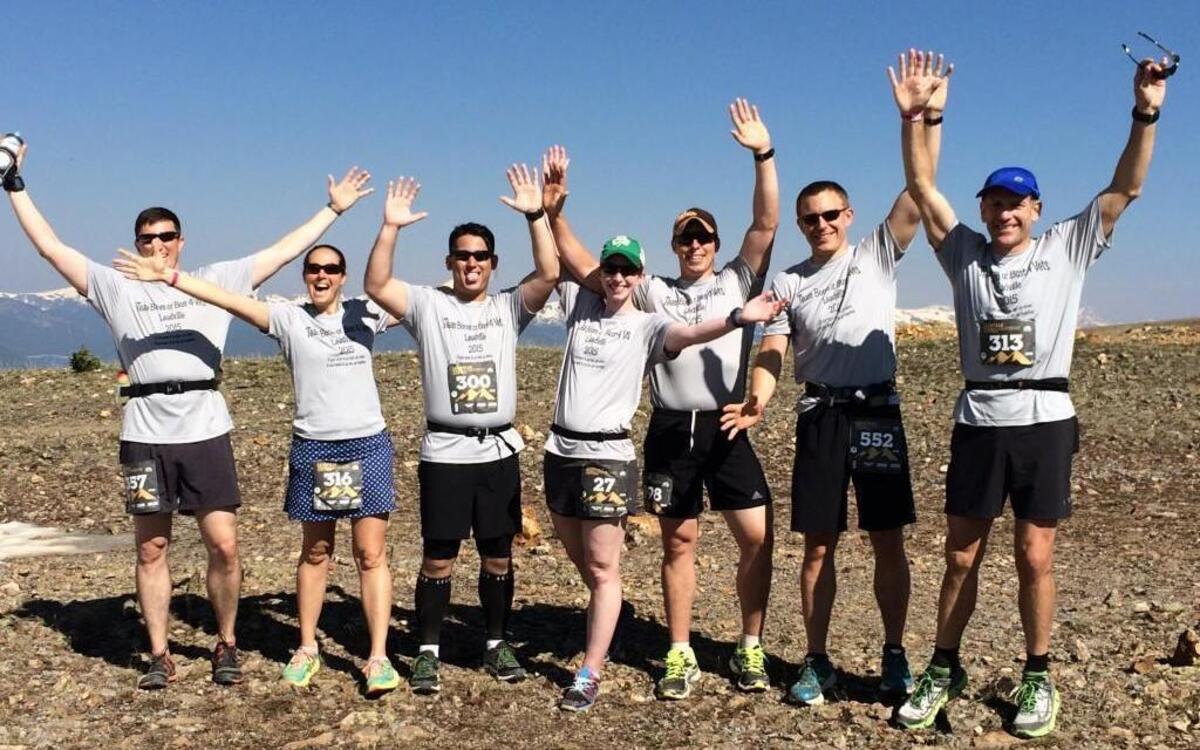 Tony Hofmann (right) celebrated with his team, which is competing the Leadville Marathon in Leadville, Colo., on Saturday.