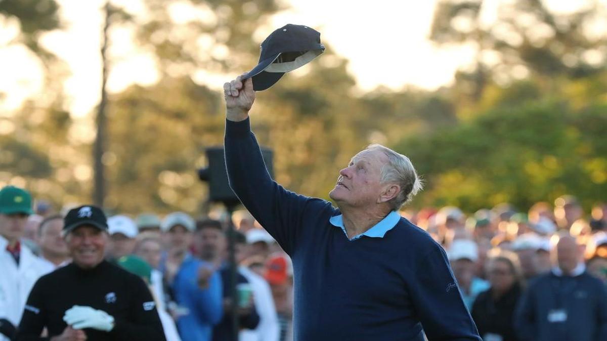 Jack Nicklaus tips his hat skyward in honor of the late Arnold Palmer, as Gary Player looks on before starting the first round of the Masters in Augusta Ga., on Thursday.