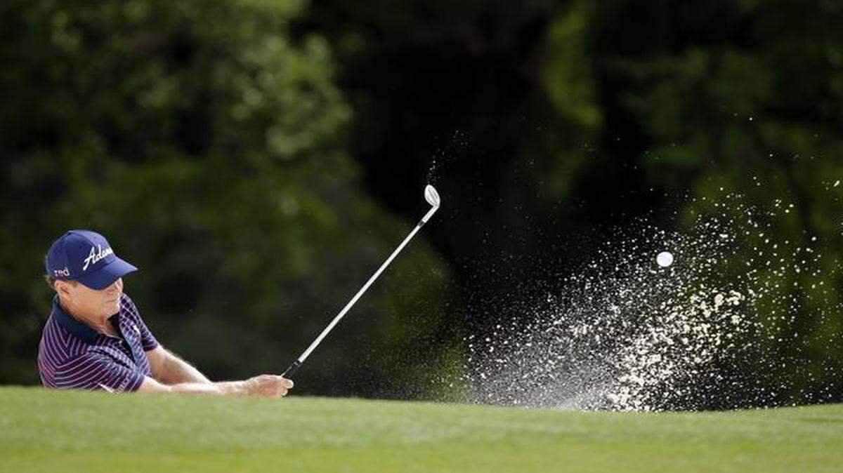 
Tom Watson hit out of a bunker on the 18th hole and finished his round Friday at 9-over 81, missing the cut.
