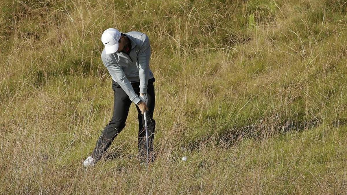 
Rory McIlroy hit from rough on the 10th hole during a practice round for the U.S. Open golf tournament at Chambers Bay on Wednesday.
