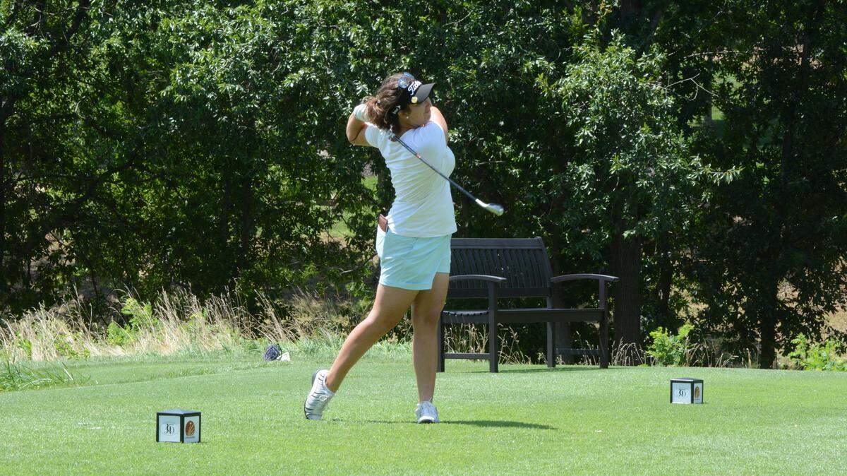 Gianna Augustine tees off at Monday’s first round of the Prairie Invitational in Parkville.