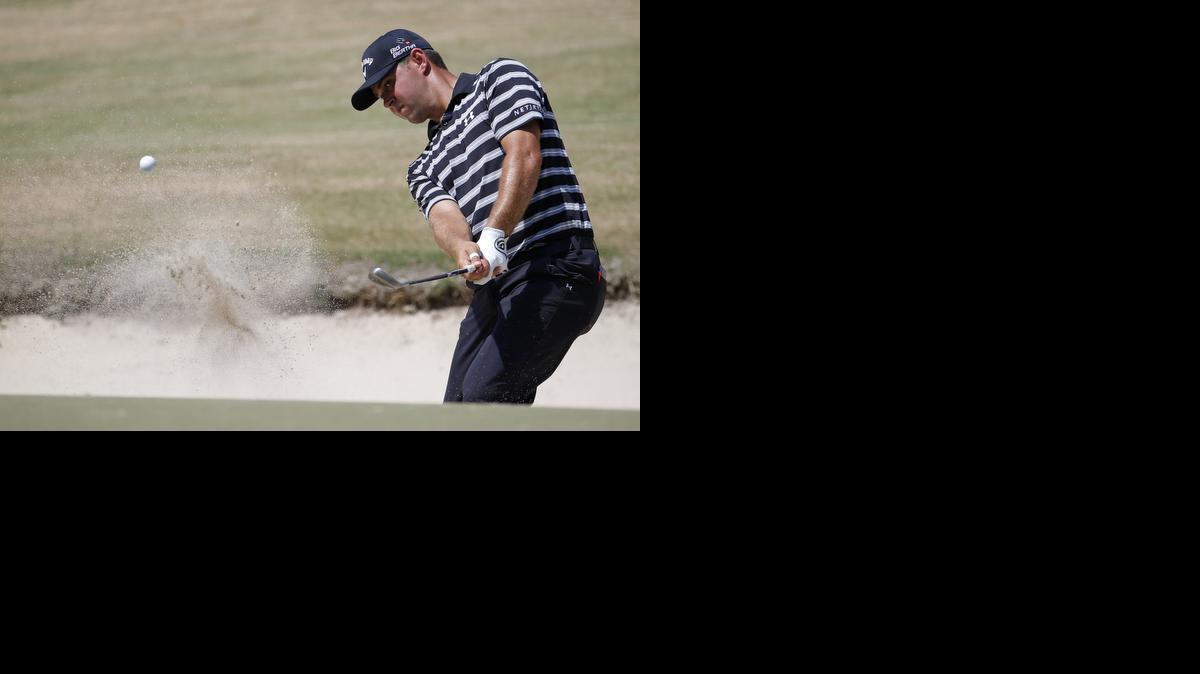
Gary Woodland hit out of a bunker during a practice round Wednesday in Pinehurst, N.C.
