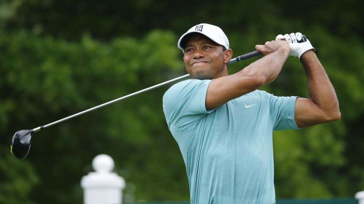 
Tiger Woods watched his tee shot on the 12th tee during the first round of the Greenbrier Classic golf tournament at the Greenbrier Resort in White Sulphur Springs, W.Va., Thursday.
