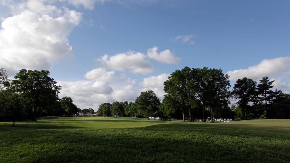 Morning light shines over the first green during the first round of the 74th Senior PGA Championship golf tournament at Bellerive Country Club on May 23, 2013, in St. Louis.