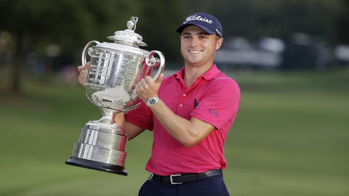 Justin Thomas posed with the Wanamaker Trophy after winning the PGA Championship golf tournament at the Quail Hollow Club Sunday, Aug. 13, 2017, in Charlotte, N.C.