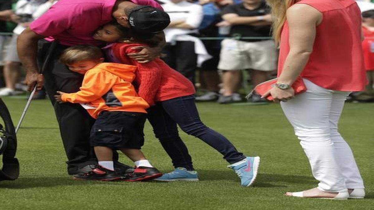 
Tiger Woods hugs his children Charlie (left) and Sam Lindsey Vonn watches as girlfriend Lindsey Vonn watches during a practice round for the Masters golf tournament Tuesday in Augusta, Ga.
