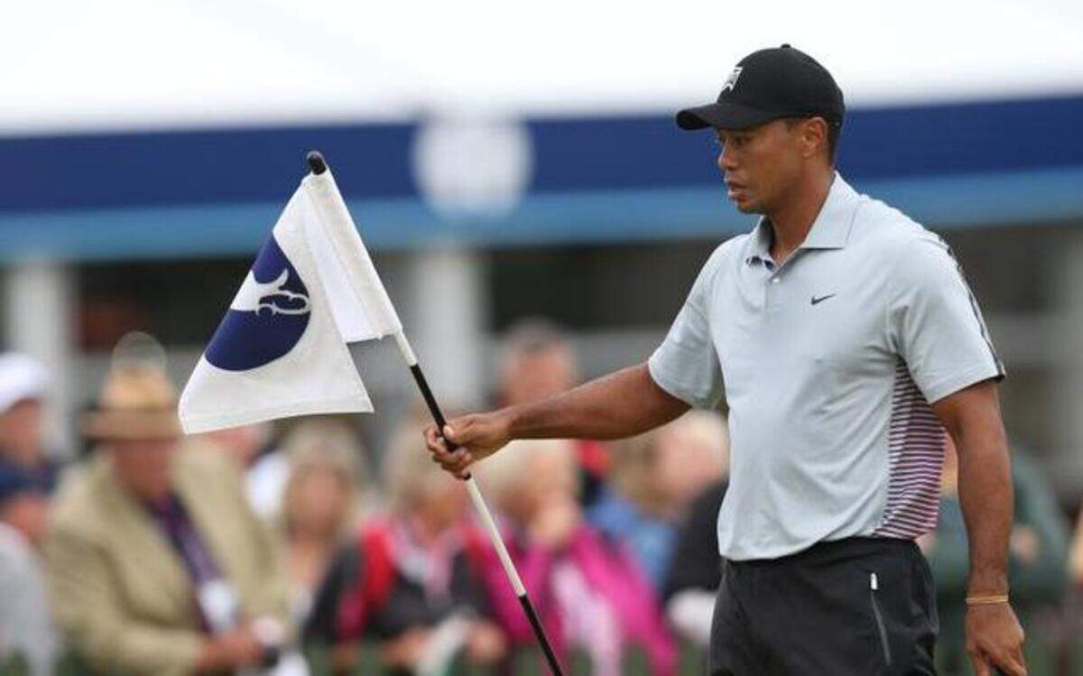 
Tiger Woods held the flag on the practice chipping green on Wednesday ahead of the British Open Golf championship at the Royal Liverpool golf club in Hoylake, England.
