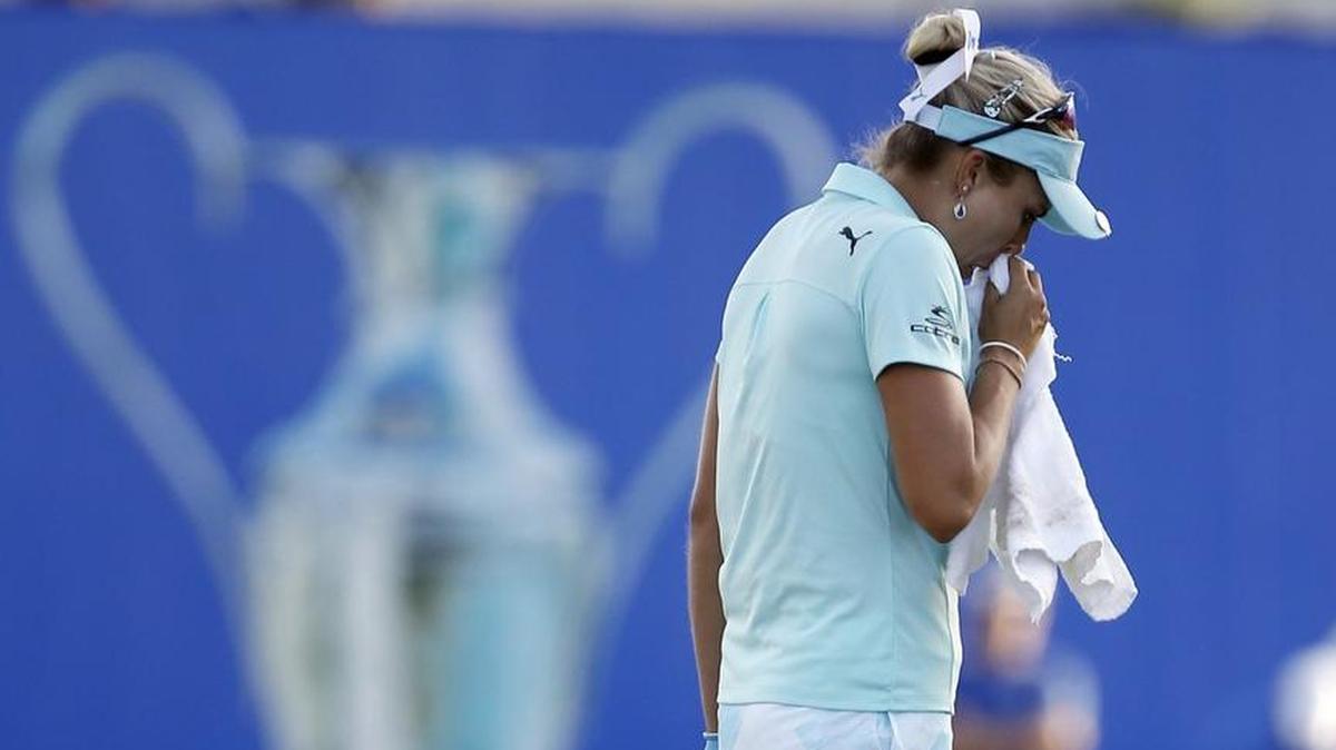 Lexi Thompson composed herself on the 18th green during the final round of the LPGA Tour’s ANA Inspiration golf tournament at Mission Hills Country Club in Rancho Mirage, Calif. Thompson was assessed a 4-shot penalty due to a TV viewer noticing a rules violation.