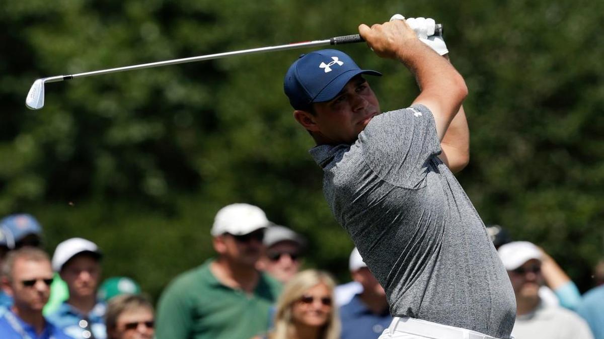 Gary Woodland follows through on his tee shot on the 13th hole during the first round of the PGA Championship golf tournament at Quail Hollow in Charlotte, N.C., on Thursday.
