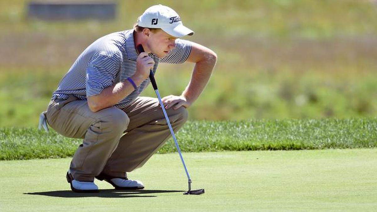 
Preston Fleenor, 17, sized up a putt Friday during the first round of the 2014 Watson Challenge at the Country Club of Loch Lloyd in Cass County. The annual event, held to determine the best golfer in Kansas City, runs through Sunday. Fleenor, who will be a senior at Pembroke Hill in the fall, finished the round with a 67, tying Sean Doughtery for the lead.
