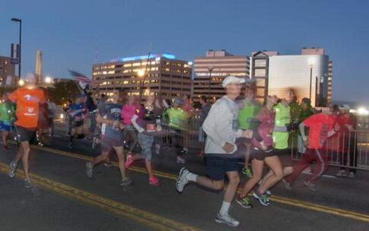 
As the sun was rising, an estimated 10,000 runners filled the streets of Kansas City on Saturday for the 2014 Waddell & Reed Kansas City Marathon. The event included a marathon, a half marathon, a 5K and a kids run.
