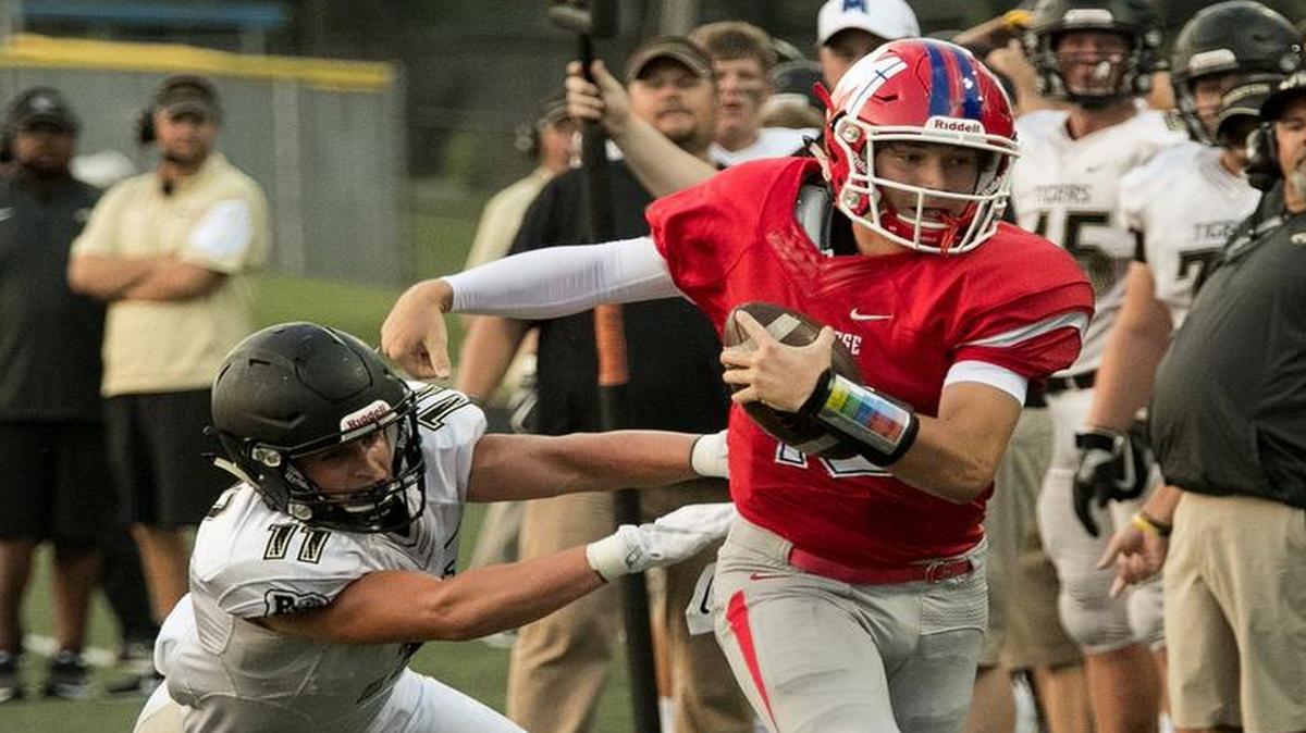 Bishop Miege quarterback Carter Putz was pushed out of bounds during a Week 1 victory against Blue Valley.