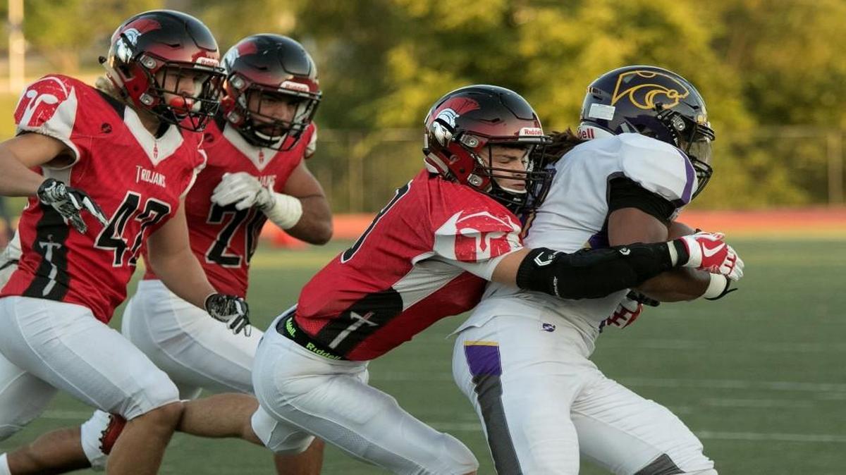 Park Hill’s Kolby Heinerikson brings down Blue Springs’ Ethan Parton during their game last Friday.
