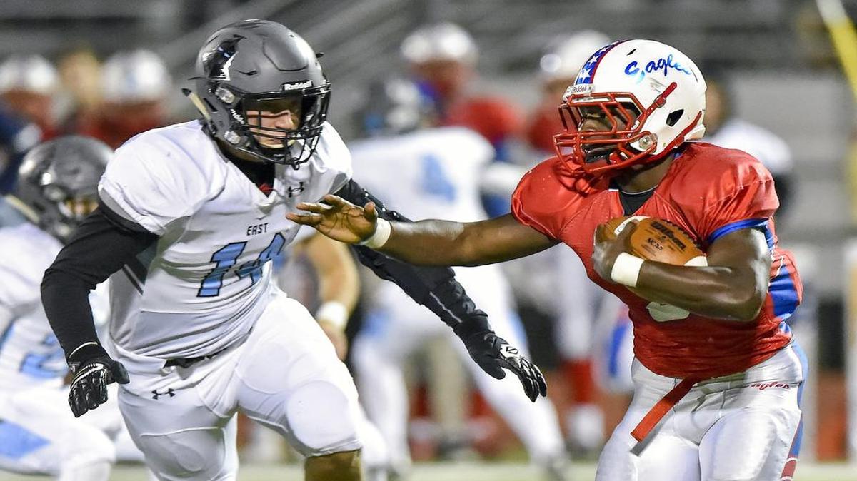 Olathe North’s Vinnie Shabazz (right) is one of three first-team running backs on the All-Sunflower League football team.