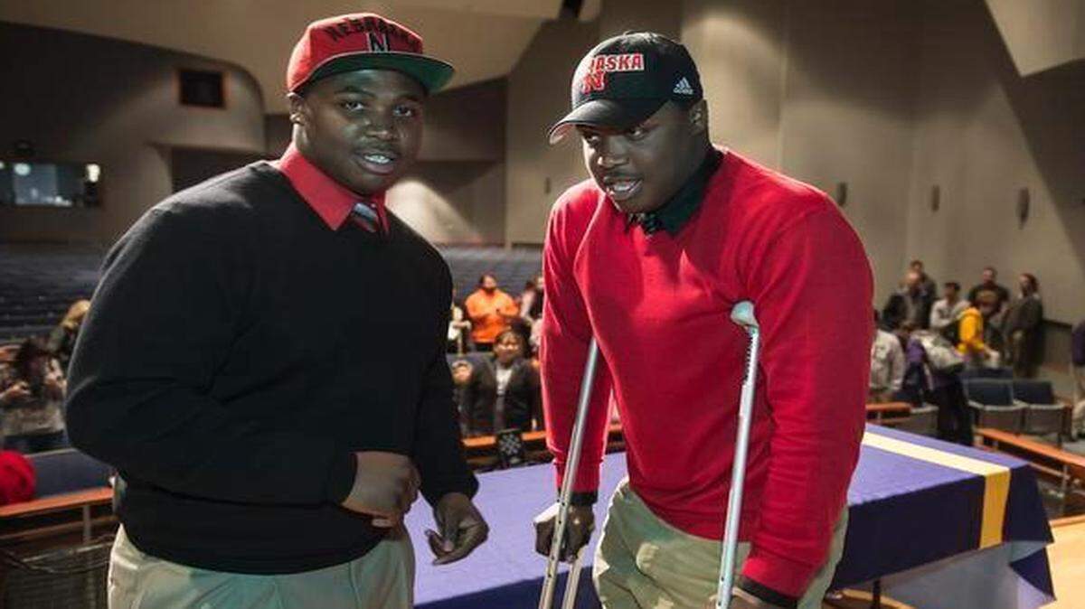 
Khalil Davis (left) and twin brother Carlos Davis signed their official letters of intent on Wednesday at Blue Springs High School to play football at Nebraska.
