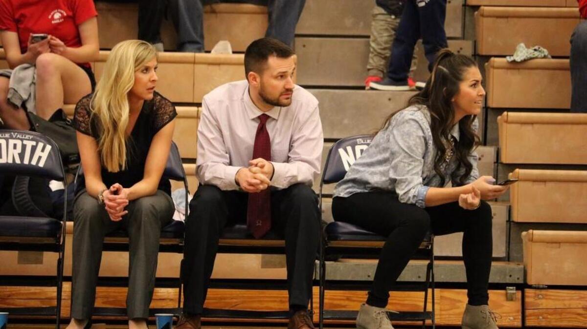 Olathe North girls basketball coach Liz Monahan (left) watches from the bench during a game this season. Monahan resigned after four seasons recently because of family issues.