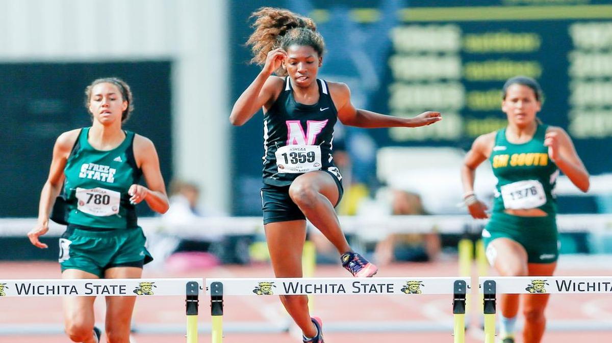
Shawnee Mission North’s Jazmin Williams (center) won the Class 6A 300 meter low hurdles at the Kansas state high school meet on Saturday in Wichita.

