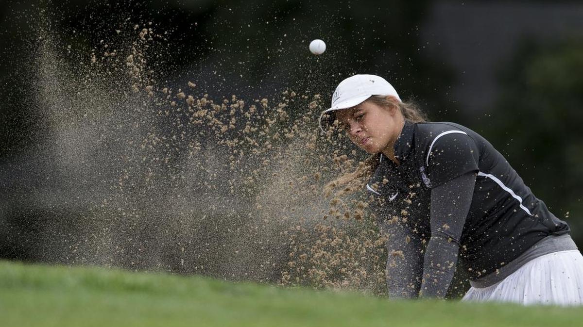 
Notre Dame de Sion’s Anna Ciani hit out of a sand trap onto the 18th green during the Missouri Class 2 Sectional 4 tournament on Monday at Adams Pointe Golf Club. Sion finished first in the team standings.
