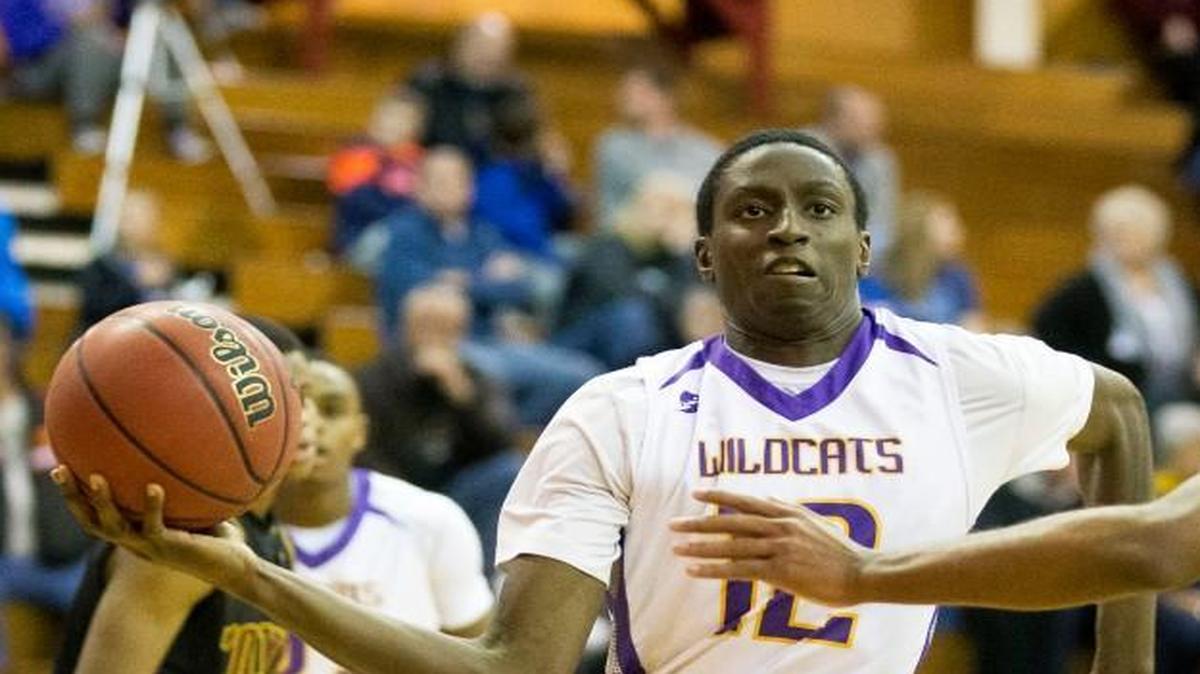 Blue Springs’ Justin Hall (left) led his team with 17 points in a 70-39 win over Winnetonka on Monday.