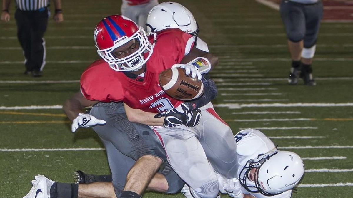 The Stags’ Jafar Armstrong stretches for a touchdown in the game Friday night against Mill Valley at Bishop Miege.