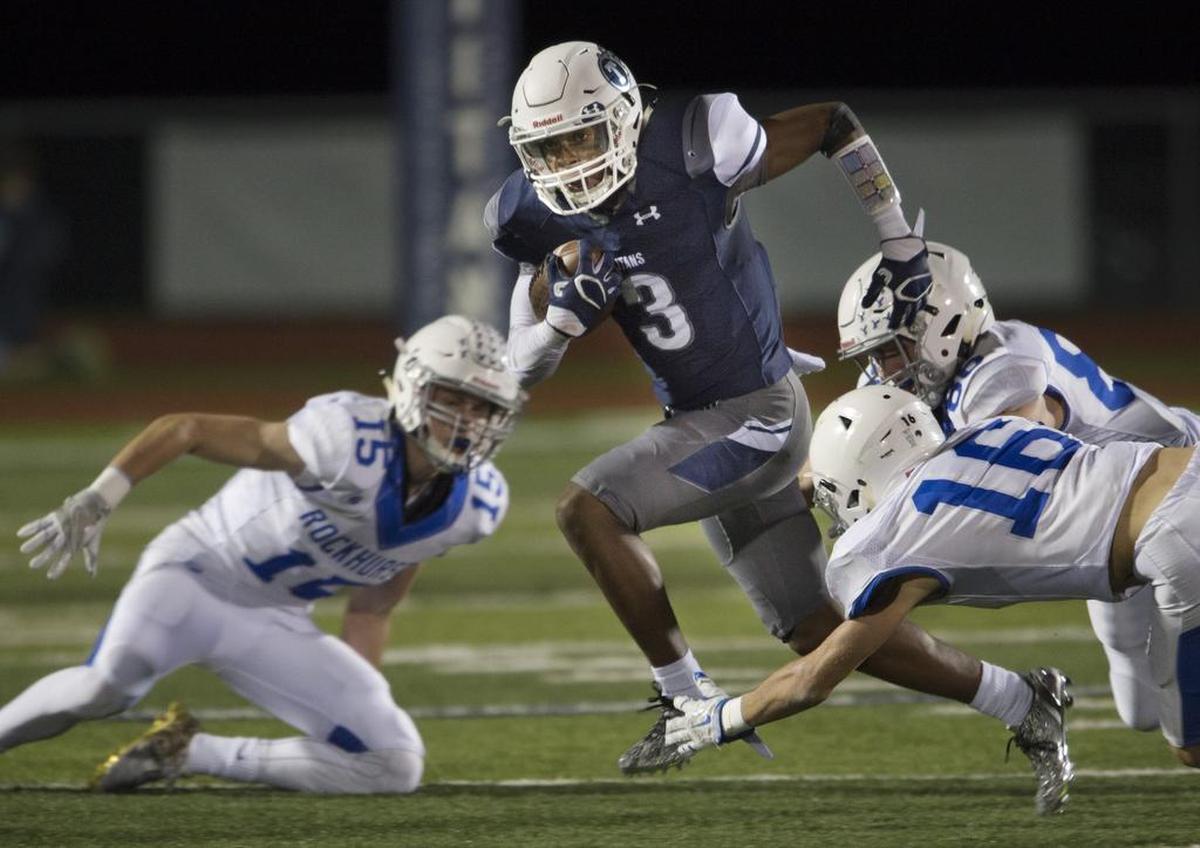 Lee’s Summit West senior Mario Goodrich, center, who has committed to Nebraska, plays on both sides of the football for the Titans this season. He is the state’s fourth-ranked recruit.