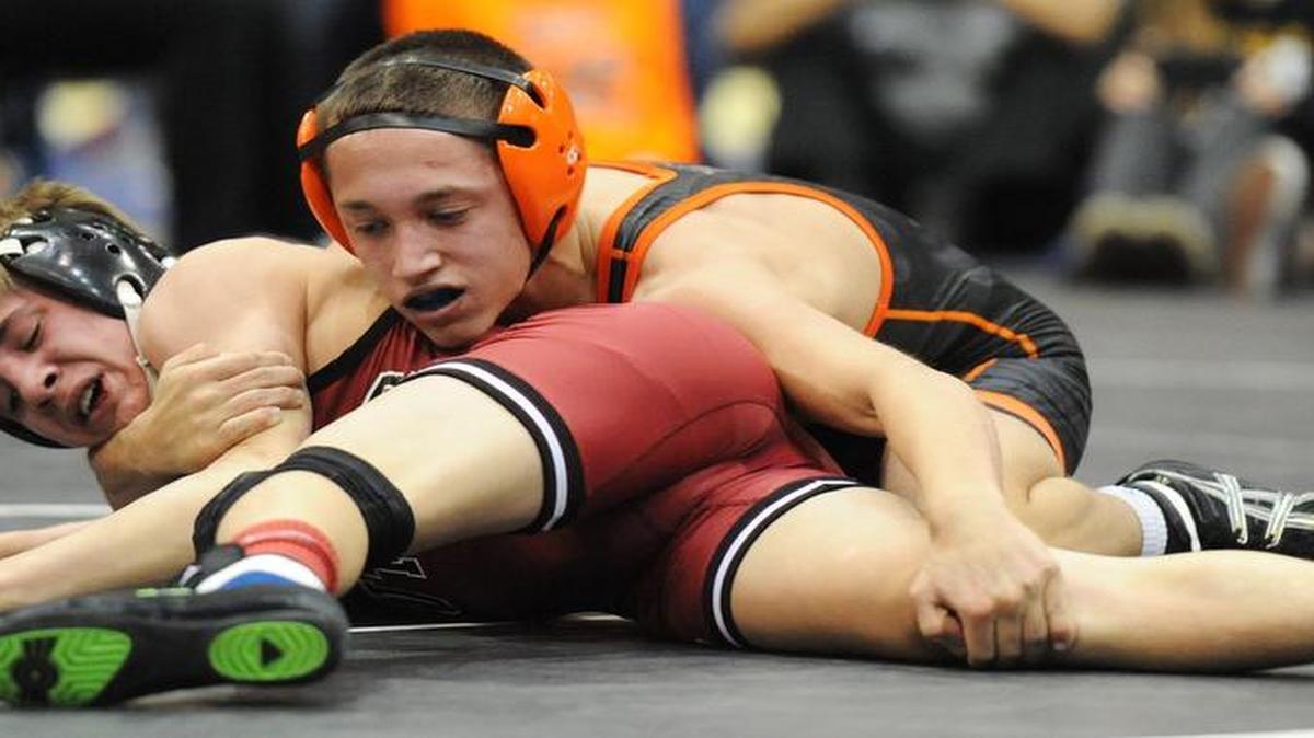 Oak Grove wrestler Connor Brown (right) won the 2014 Kansas City Stampede Wrestling championship at Hale Arena and will try for a fourth consecutive Missouri Class 2 championship this season.