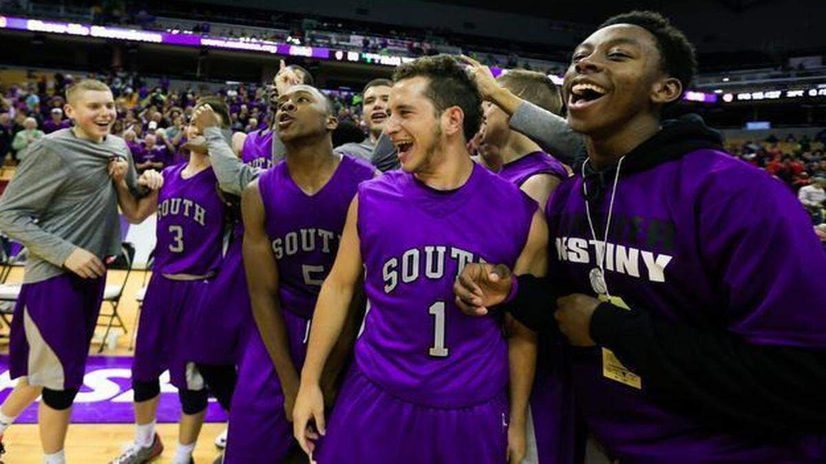 
The Park Hill South Panthers celebrate defeating the Chaminade Red Devils 53-50 on Friday at Mizzou Arena in Columbia.
