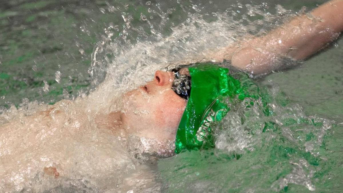 Josh Buss, of Shawnee Mission South, competed in the 100-yard backstroke at the Sunflower League boys swim meet.