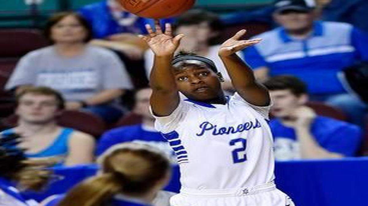 
Leavenworth’s Daysha Thomas makes a three-pointer in the second quarter of the Pioneers’ 45-35 victory over Kapaun Mt. Carmel on Friday in a Kansas 5A girls basketball state semifinal game at the Kansas Expocentre. 
