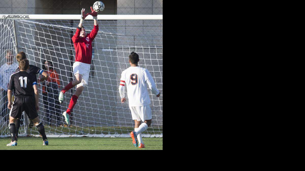 
Olathe East Hawks goalkeeper Colin Shepard makes a save against Washburn Rural in the second half on Saturday in the Kansas Class 6A title match at Hummer Sports Complex in Topeka. Olathe East beat Washburn Rural 2-1.
