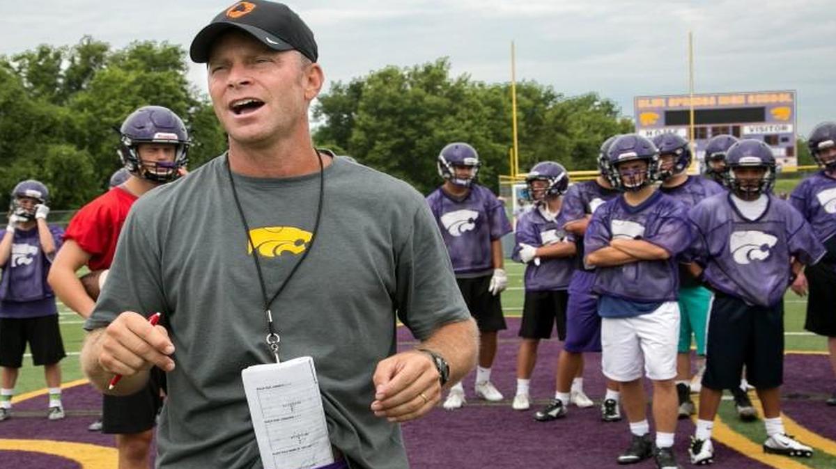 Blue Springs head football coach Kelly Donohoe talked his players through a drill last month during the first day of high school football practice for Missouri high schools.