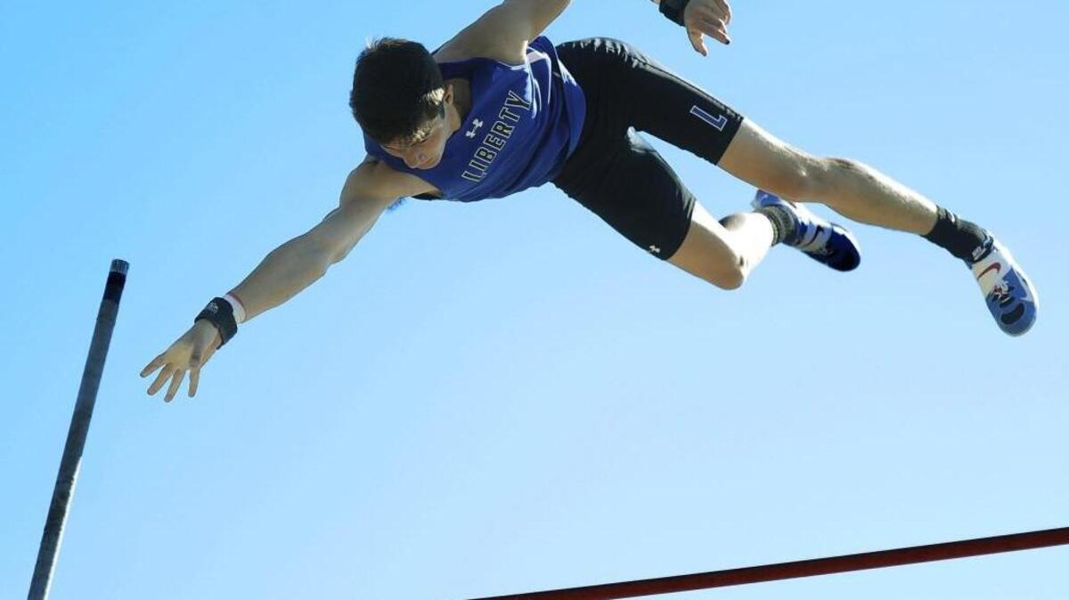 Kyle Rogers of Liberty easily clears the bar on his way to a first-place finish in the boys pole vault during the Class 5 District 8 track meet Saturdayat Park Hill. Rogers won with a vault of 16 feet.