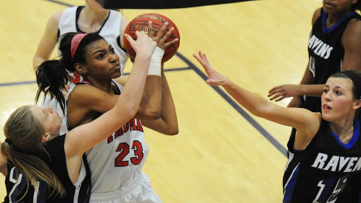 Kierra Collier (with ball) of Truman High School