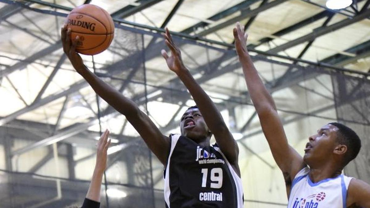 Mark Mitchell Jr (left) was a powerful force inside for Drive5 Power Elite at the Jr. NBA World Championship. Representing the Central Region, the Overland Park-based team beat the Africa and Middle East team 60-50 Sunday for the world championship.