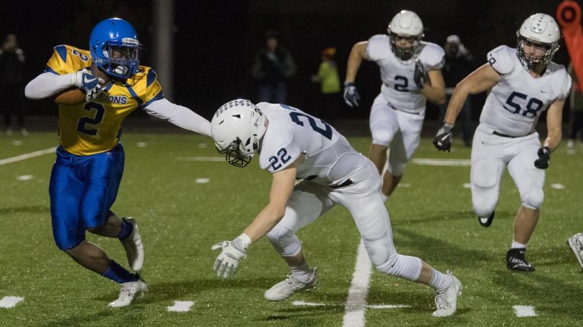 Ivan Webb of Schlagle tries to avoid the tackle of Mill Valley’s Ryan Bauer during a game this season.