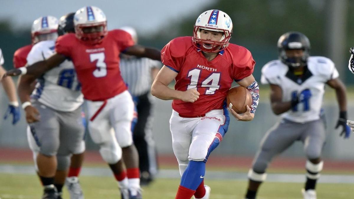
Olathe North quarterback Matt Wright ran for a touchdown in the first quarter Friday against Leavenworth. He ended up running 152 yards in the first half alone.

