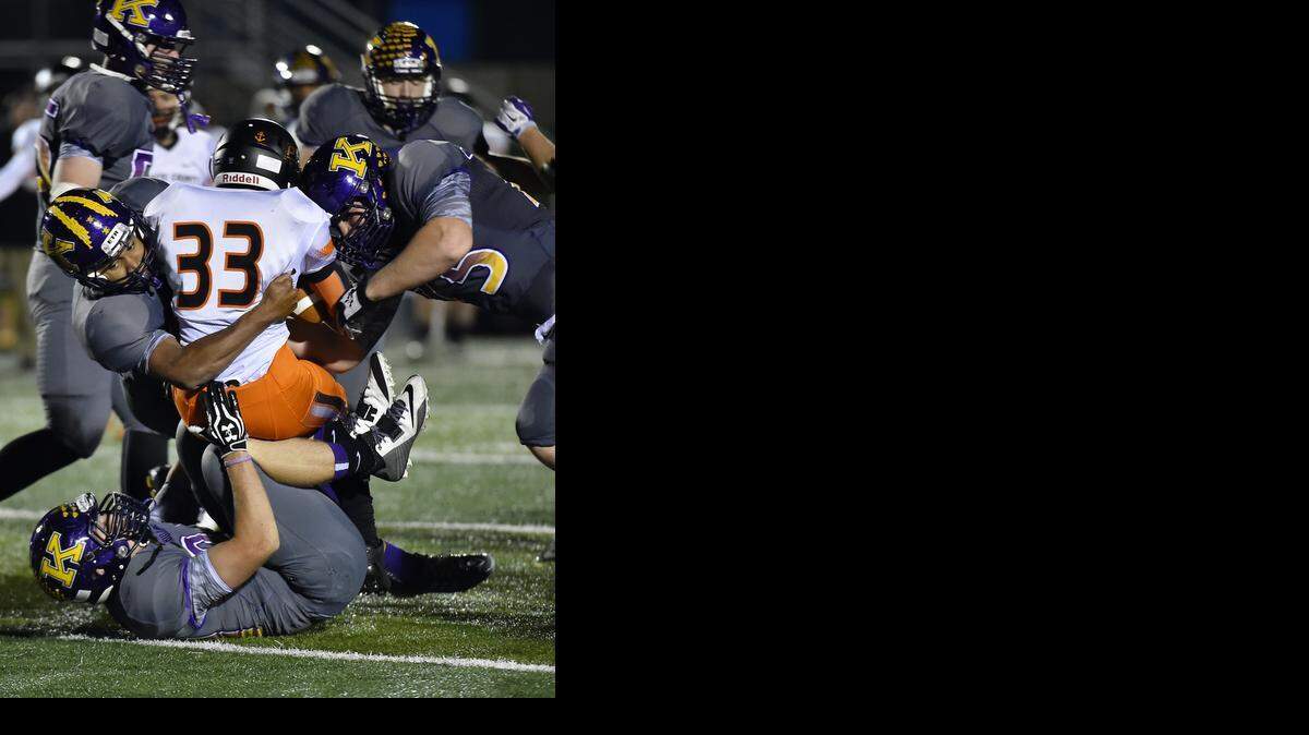 
Kearney’s defense swarmed around Platte County's Michael McNair during second-quarter action in their game on Friday night. Kearney won 52-6.

