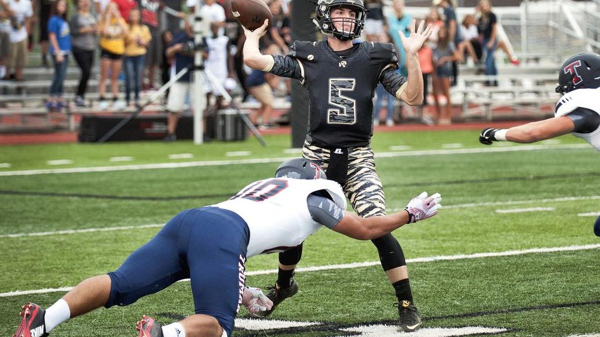 
Lee’s Summit quarterback Dalton Hill throws a pass during the first half against Truman during their game Friday night at Bud Hertzog Stadium in Lee’s Summit.
