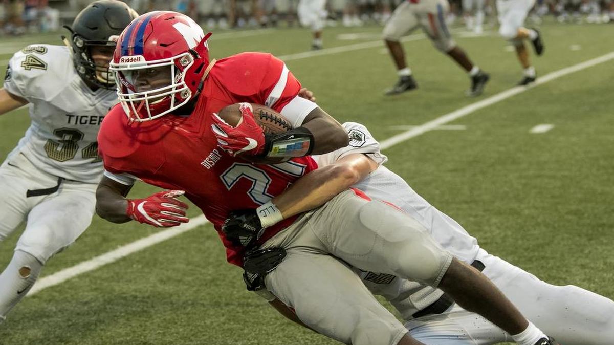 Cameron Clark (with ball) and Bishop Miege opened up with a win last week over Blue Valley.