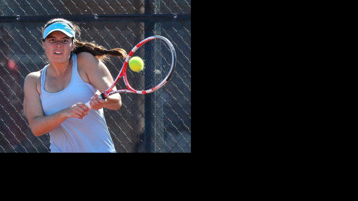 
Shawnee Mission East Elizabeth Barnickel returns a serve Saturday, Oct. 18, 2014, at the 6a State Championship in Topeka.
