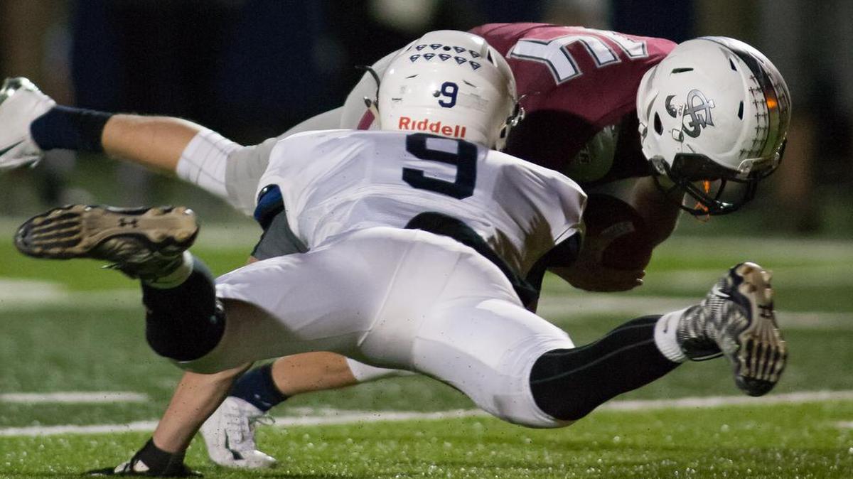 
Mill Valley senior Cole Morris (No. 9) sacked St. James Academy quarterback Trey Keith during their game on Friday night.
