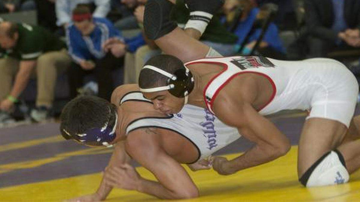 
Ke-Shawn Hayes of Parkhill (right) battled Joe King of Blue Springs for first place in the 138 lb weight class finals of the Missouri Class 4 District 4 wrestling tournament on Feb. 14 at Blue Springs High School. Hayes won the match.
