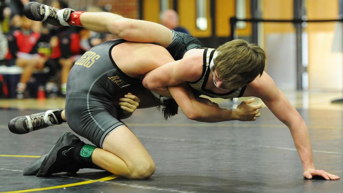 Raymore-Peculiar’s Maren Cahill (left) defeated Ozark’s Cole Roark 5-2 in the third-place match Saturday in the Class 4 District 3 tournament Saturday at Lee’s Summit.