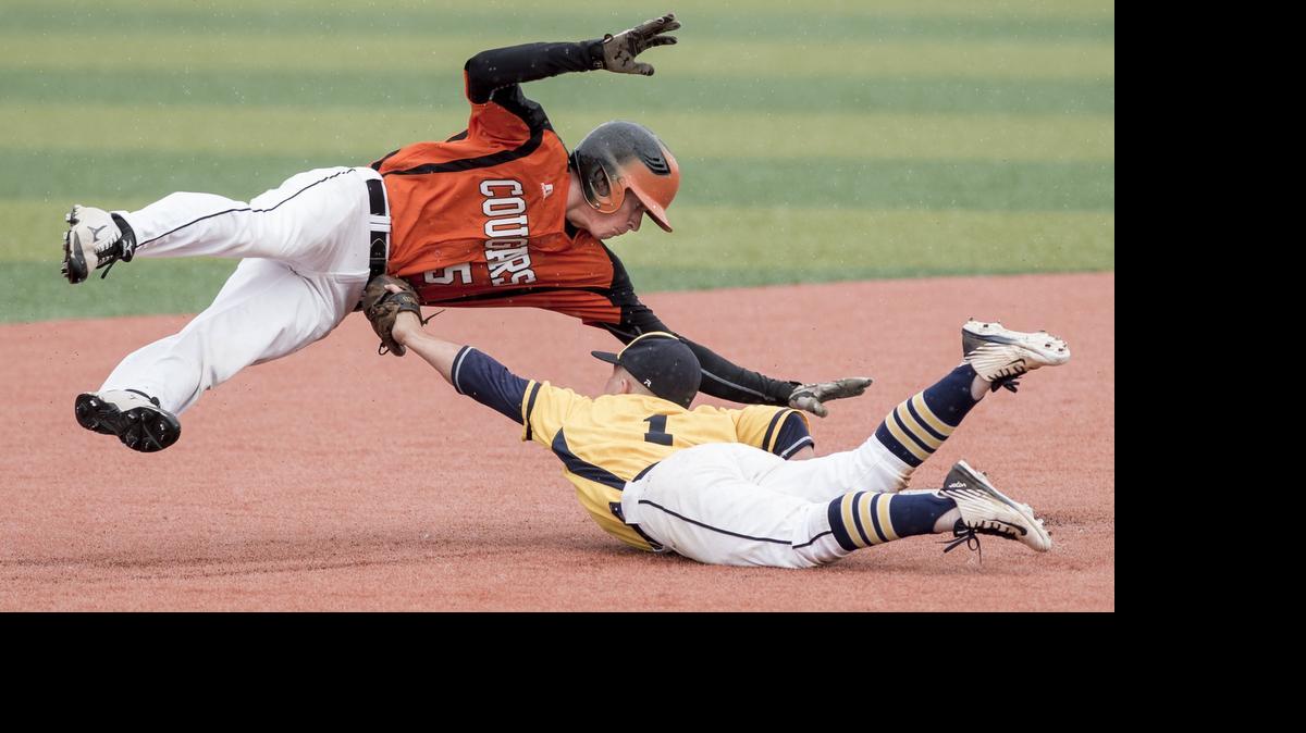 
After sliding past the bag, Shawnee Mission Northwest’s Casey Kelly (top) tries unsuccessfully to dive over Wichita Northwest second baseman Dylan Gates to get back to the base. SM Northwest won the game and advances to Friday’s semifinals at the Kansas Class 6A baseball state tournament in Lawrence.
