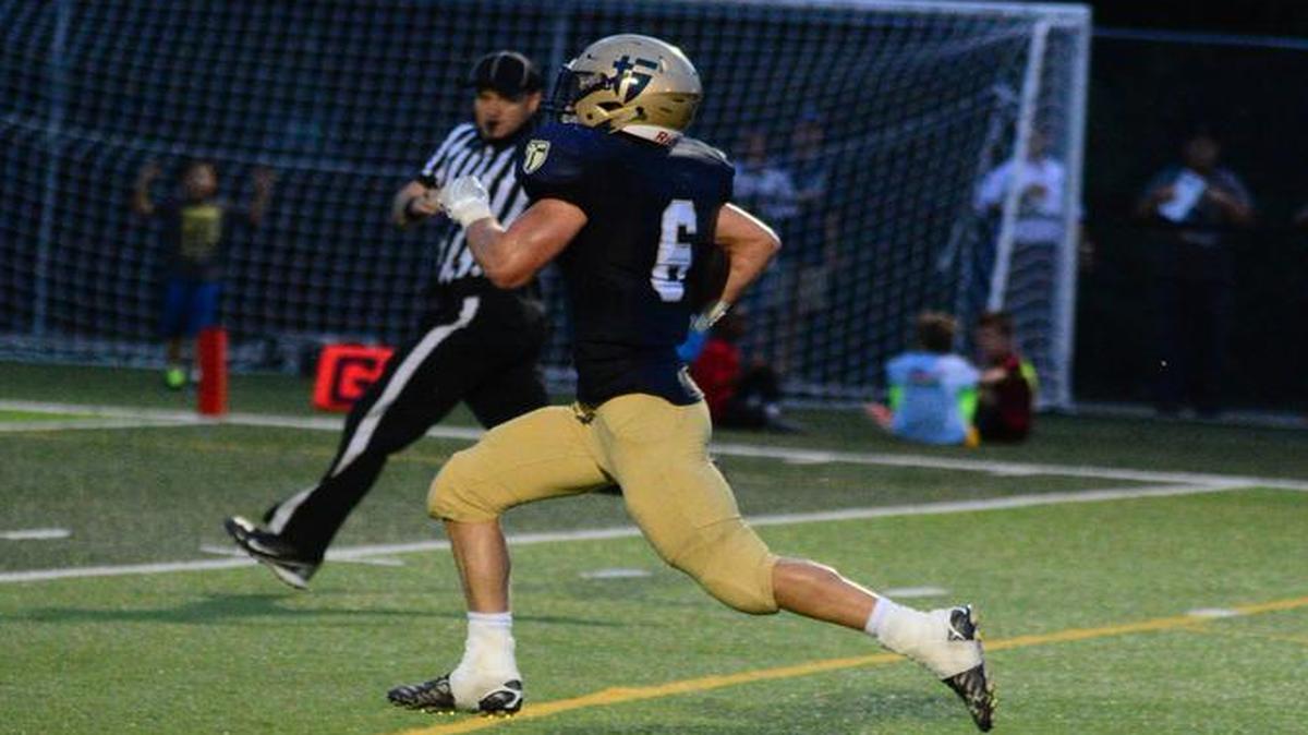 Mason Howard scored on a 49-yard touchdown reception for St. Thomas Aquinas during their Eastern Kansas League game on Friday against Blue Valley North. Aquinas won the game, 35-14.