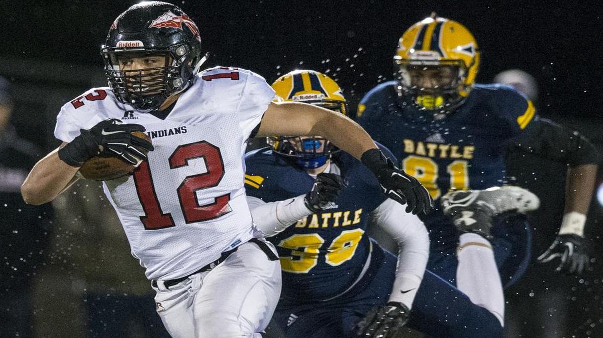 Isaiah Iloilo of Fort Osag looks for yardage against Battle in their game Friday night in Columbia.