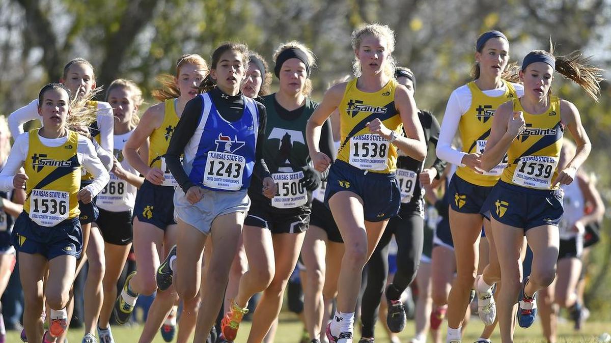 
The St. Thomas Aquinas girls cross country team last year won a Kansas team state championship. A change in rules this season means both girls and boys postseason races will be 5 kilometers. Last year the girls postseason distance was 4 kilometers.
