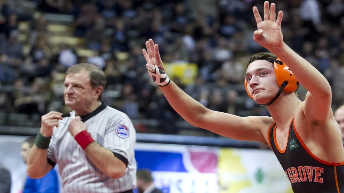 Oak Grove senior Connor Brown held up four fingers on each hand on Saturday at Mizzou Arena. They represent his four Missouri state wrestling titles. He picked up his fourth on Saturday.