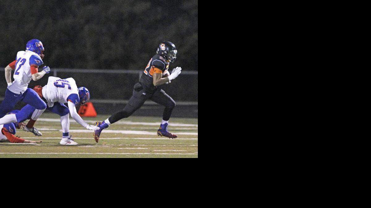 
Oak Grove’s Aaron Graham turned the corner on a 76-yard touchdown run early in the Panthers’ Missouri Class 3 state semifnial game against California last Friday night at Oak Grove.
