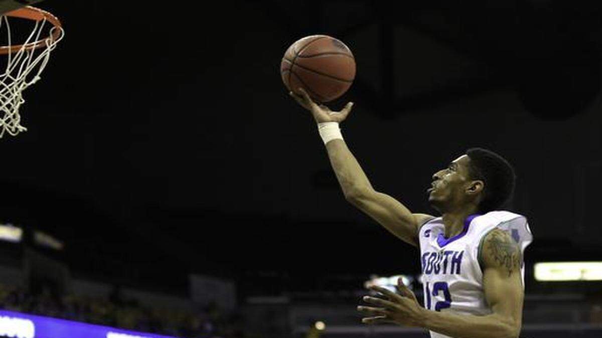 
Brandon Kilgore of Blue Springs South soared high for a shot against Mitch Henderson of Park Hill South during their Class 5 state title game at the Show-Me Showdown at Mizzou Arena.
